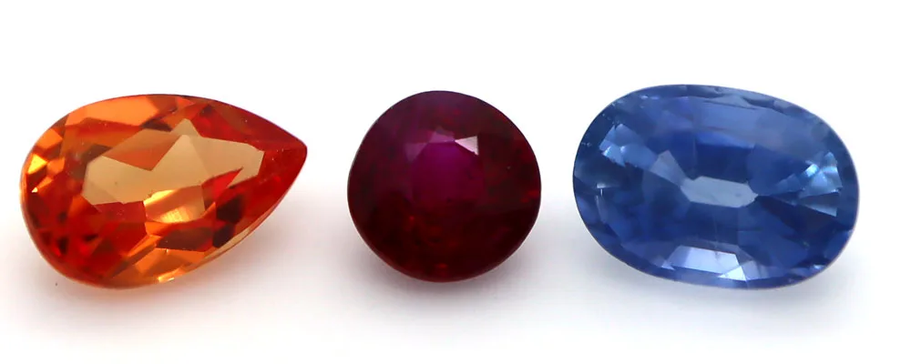 Orange Sapphire, Ruby, Blue Sapphire, all members of the Sapphire family of gemstones