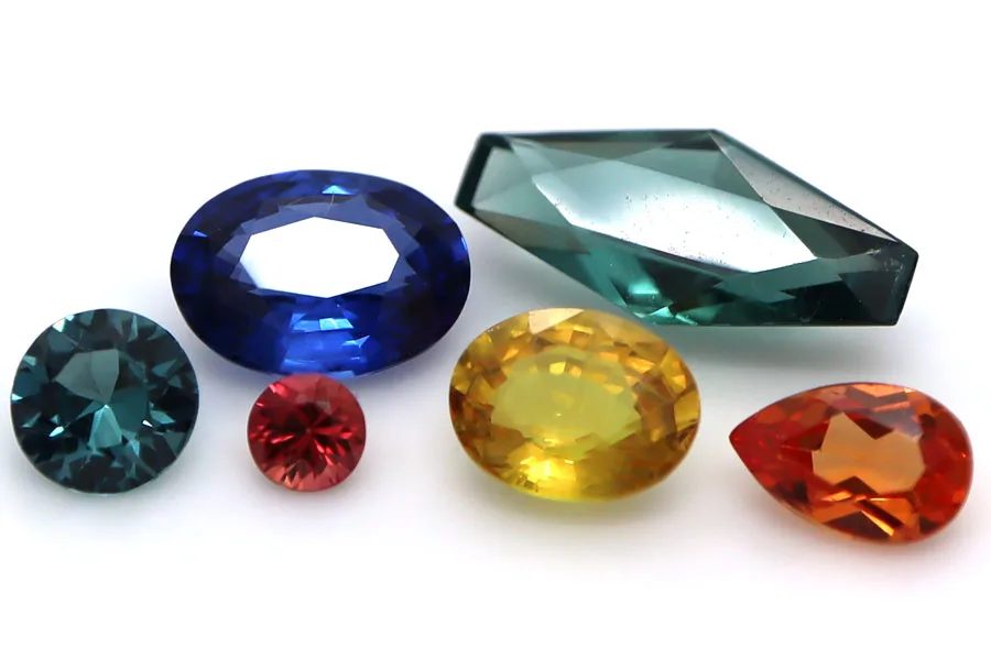 Mixed colour Sapphires on white background
